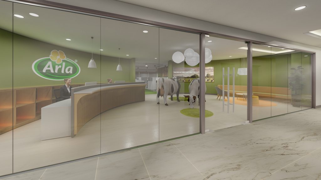 Reception area with curved wood desk and green accent wall