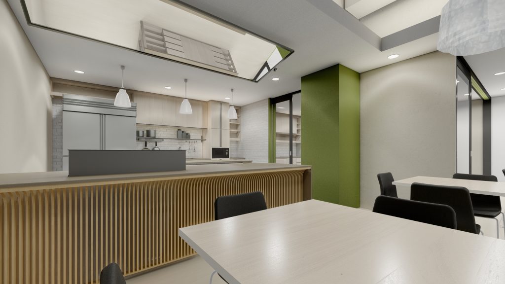 Break room kitchen with light wood island and red stand mixer