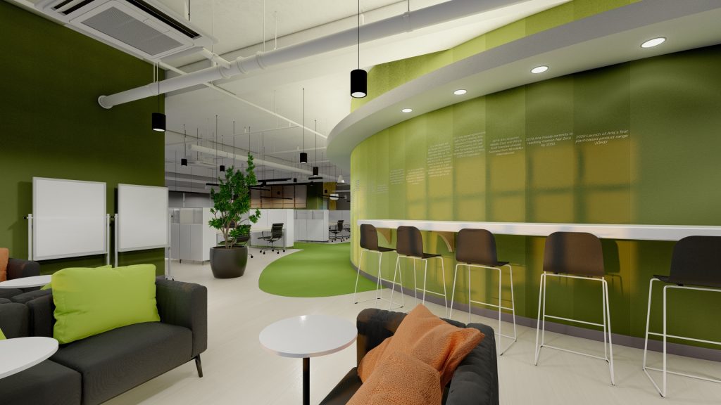 Open collaborative space with bar seating and green sofa