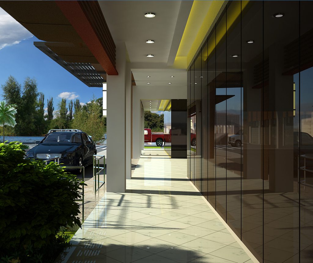 Covered building entrance with glass doors and landscape design